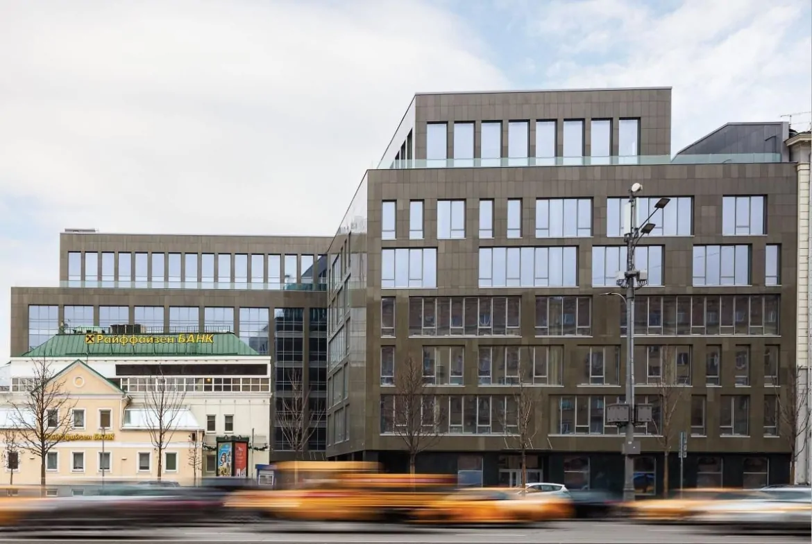 Floor-to-ceiling windows offering breathtaking views of Moscow's historic heart, the iconic MFA tower, and the Garden Ring roadway